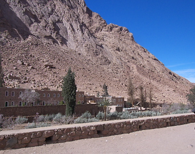 Part of the Monestary ourside its walls and hills behind it